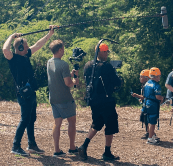 Jim Kulakowski and other crew capturing sound and video on a production by the Care Camps Foundation.